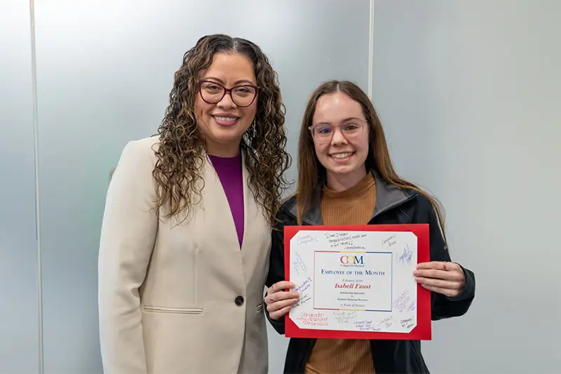 Feb 2026 Employee of the Month Isabelle Faust receiving certificate from COM president Dr. Helen Castellanos Brewer