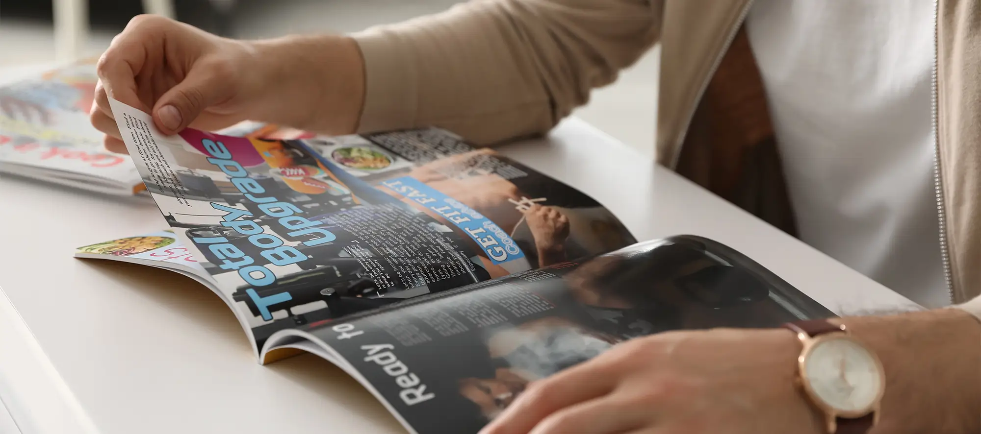 Person looking thru publication.