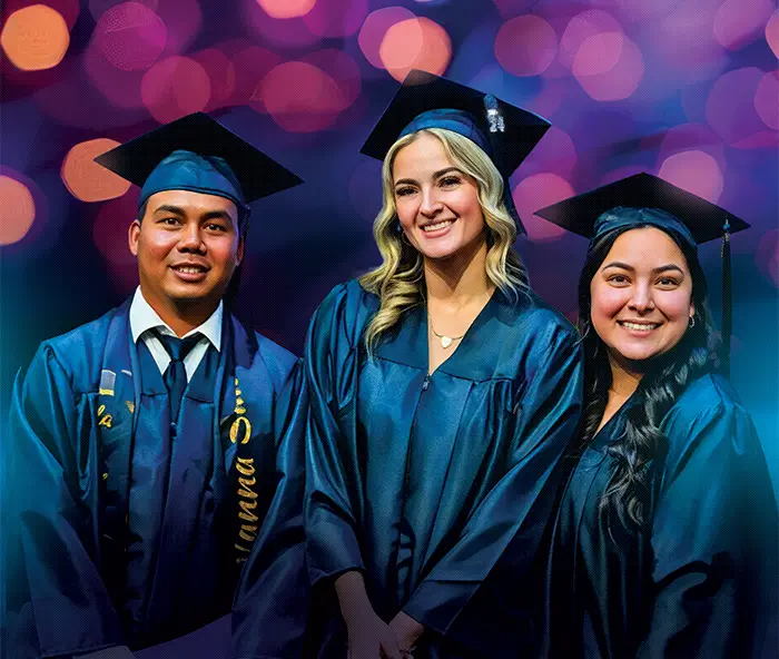 Three students in graduation caps and gowns