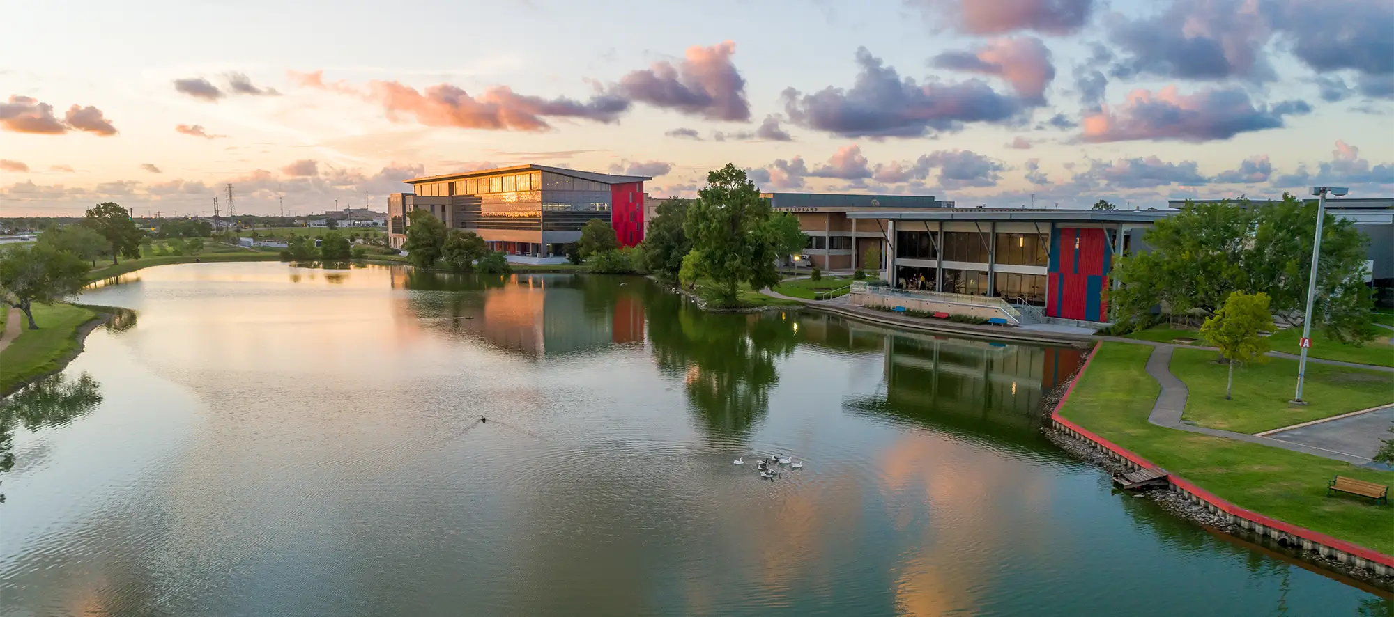 Birdseye view of COM campus and lake.