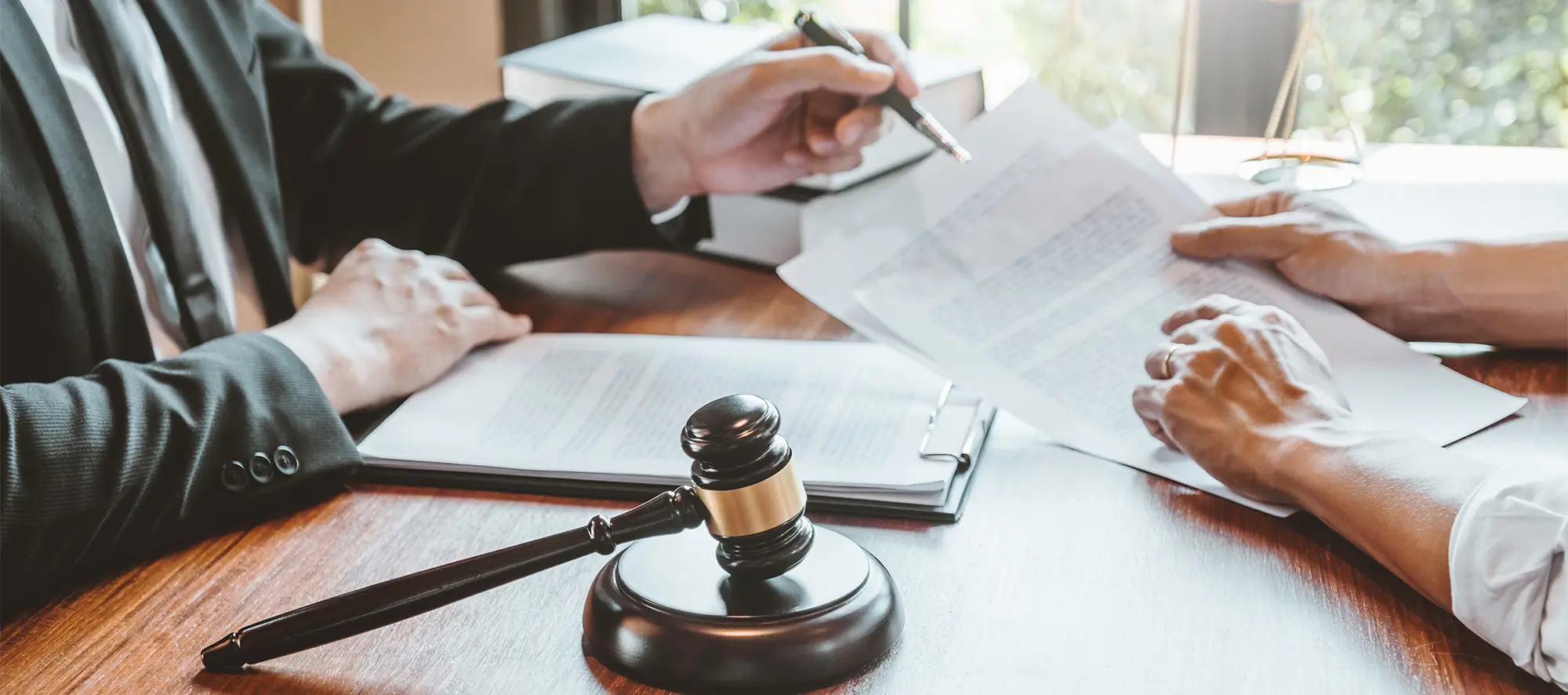 Legal professional going over paperwork with person