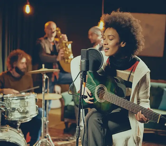 Female guitarist performing gig