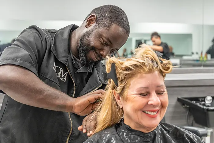 Man dying hair at the salon at com.