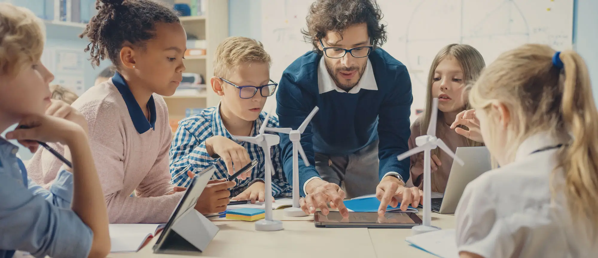 Teacher doing a windmill project with a group of kids