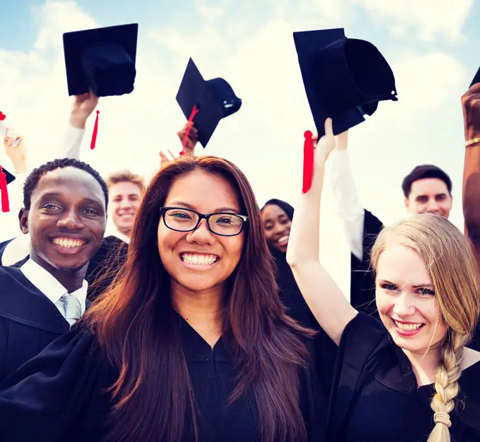 High School graduating students throwing hats in the air