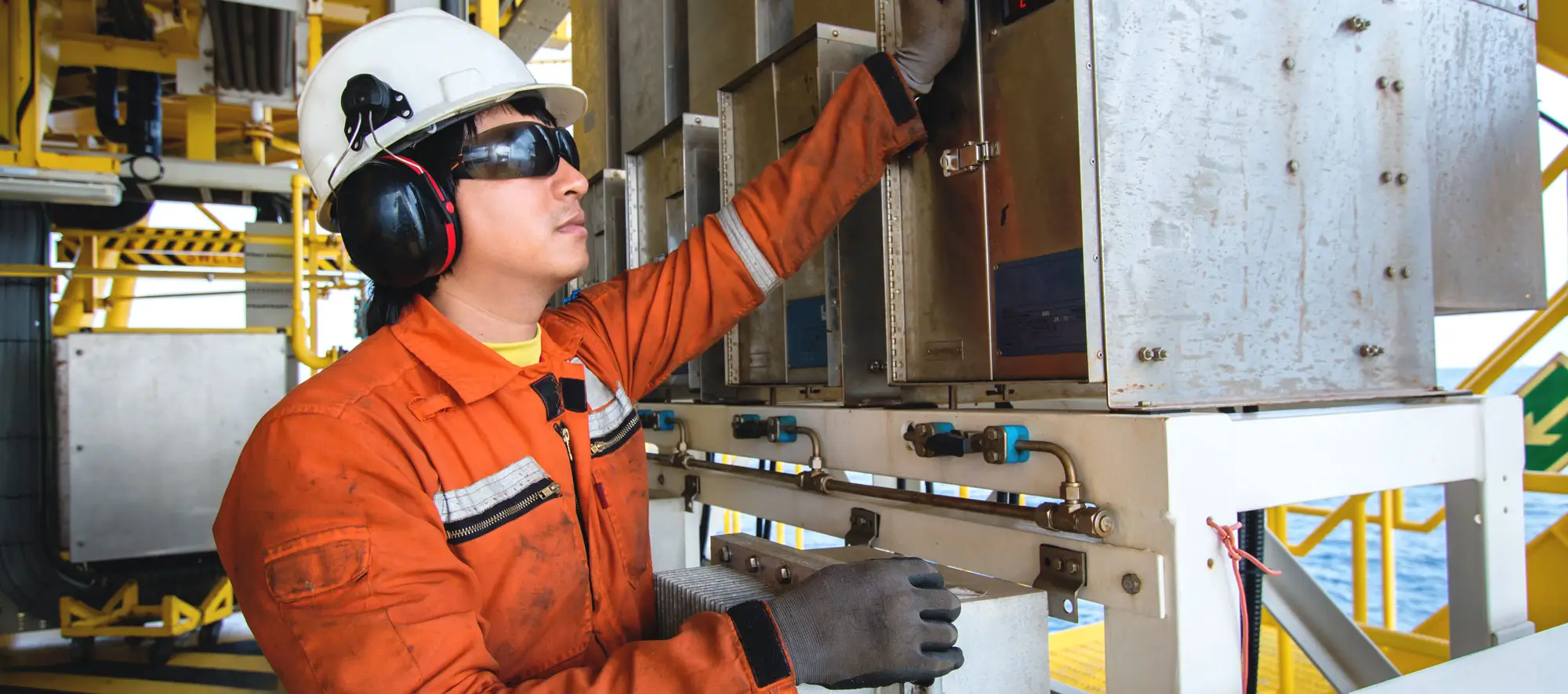 Technician,Instrument technician on the job recording morning data.