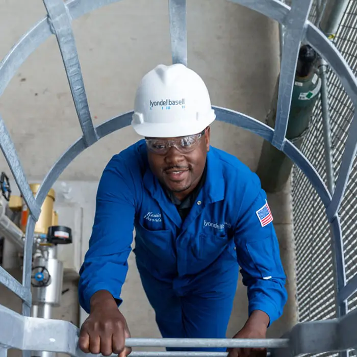PTEC student climbing tower in separation unit.