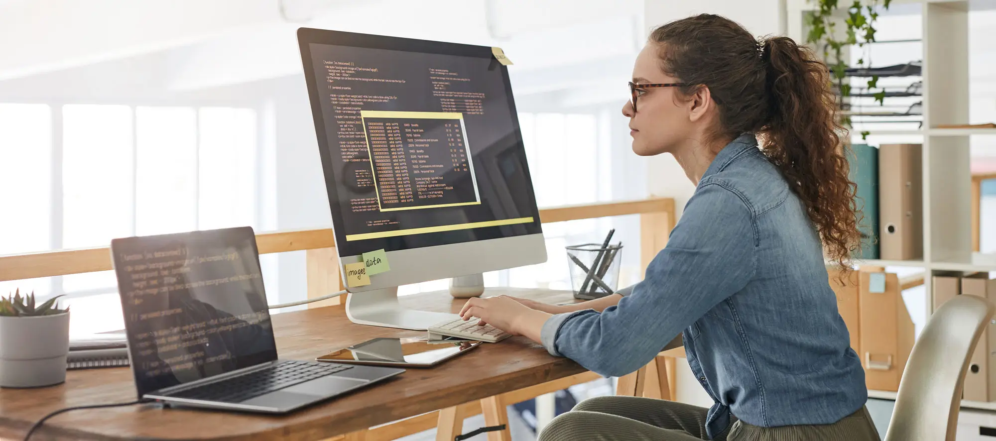 Young Woman Writing Software Code