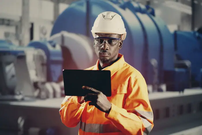 African Engineer Man Checking Industrial Facility. Osha Inspection