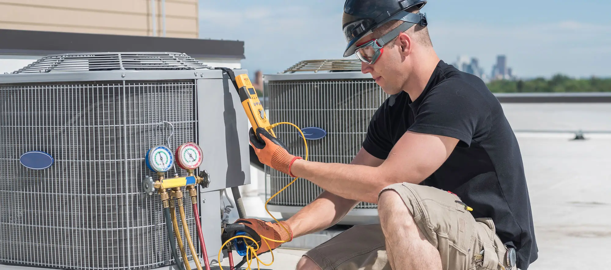 Hvac technician inspecting an condensing unit.