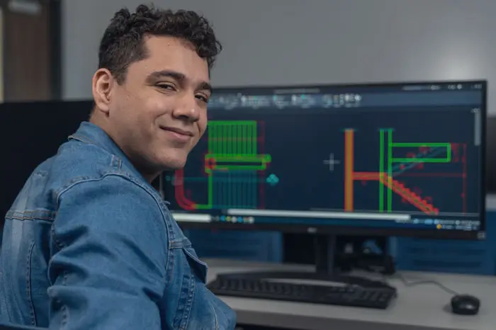 Male student at drafting computer