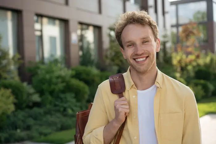 Male student outside building