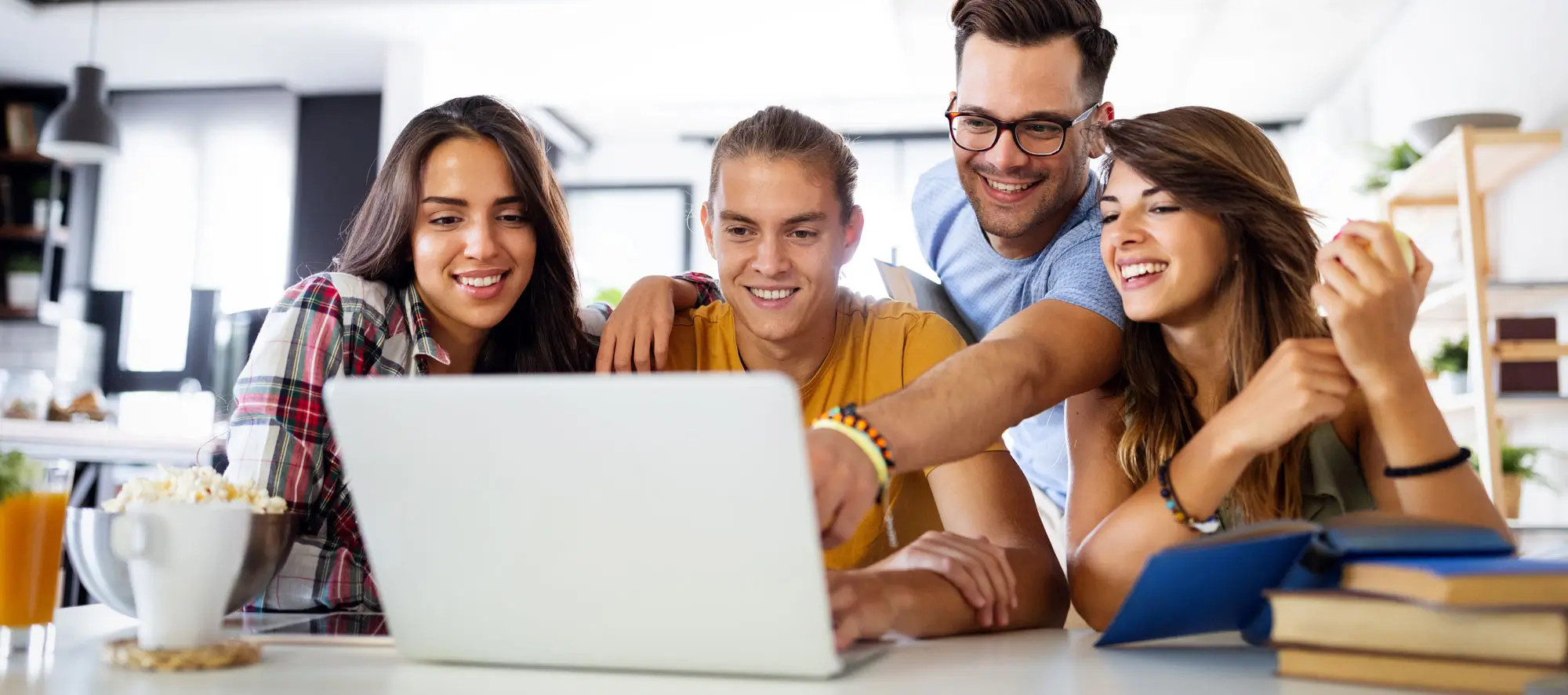 Young people enjoying group study at table.