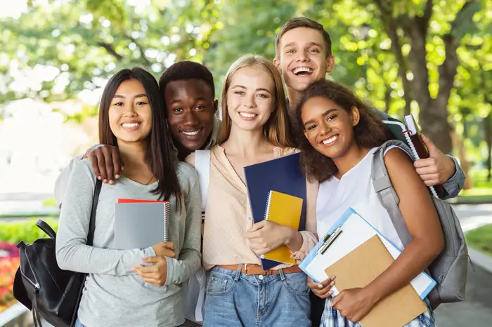 Group of young multi-ethnic students outside