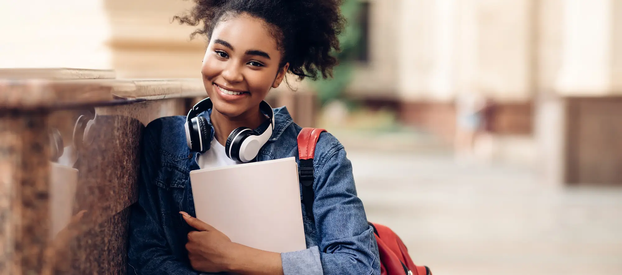 Happy Student Girl Holding Books Posing Near University Building