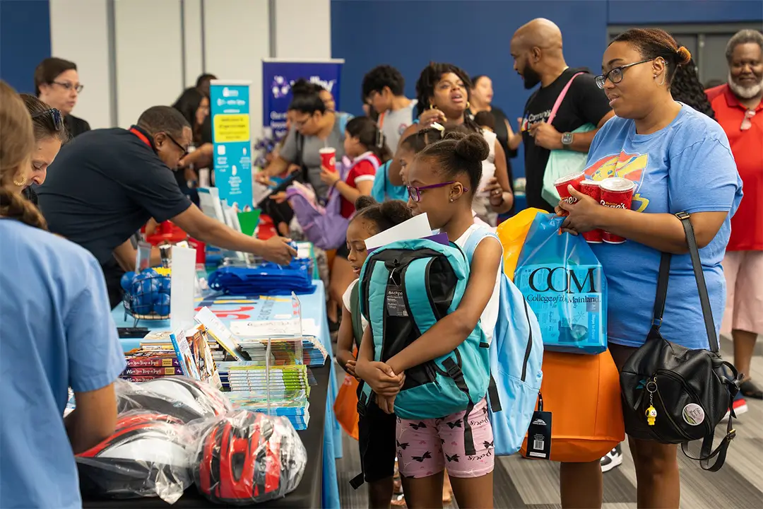 A Family Meets with the Galveston County Medical Society during the Back-to-School Bash at College of the Mainland.