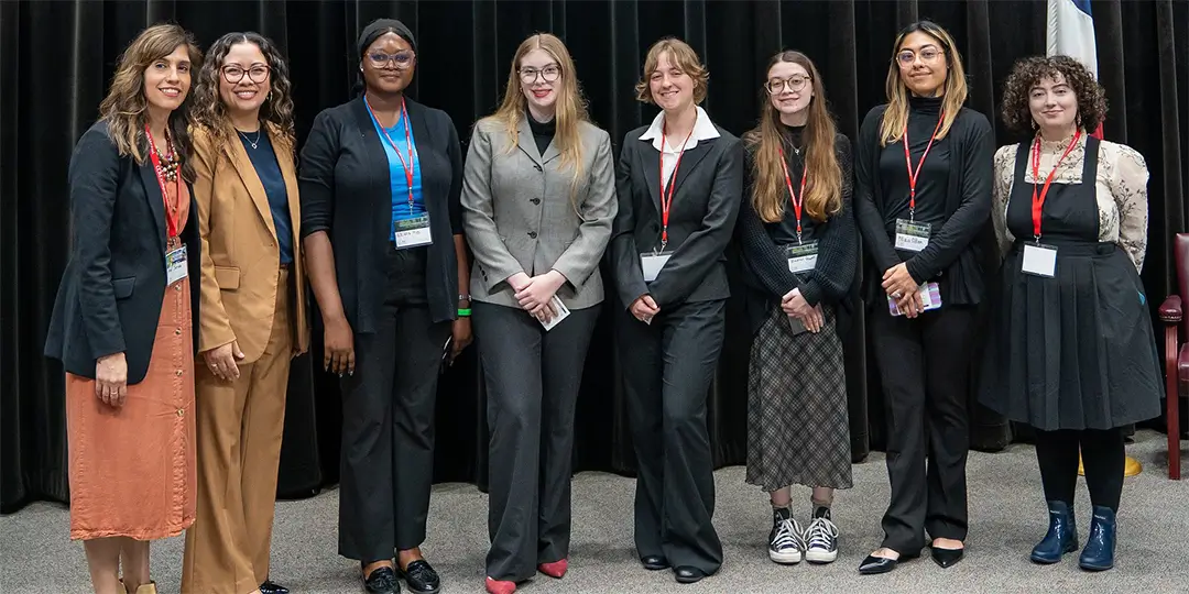 From left: Dalel Serda, COM Professor and GCIC Symposium co-chair; Dr. Helen Brewer, Executive Vice President for Academic and Student Affairs; Temiloluwa Lewis; Nova Dowdell; Maddy Snow; Madison Howell; Maci Allen; Gwendolyn Barbee-yow, COM Professor and GCIC Symposium co-chair.