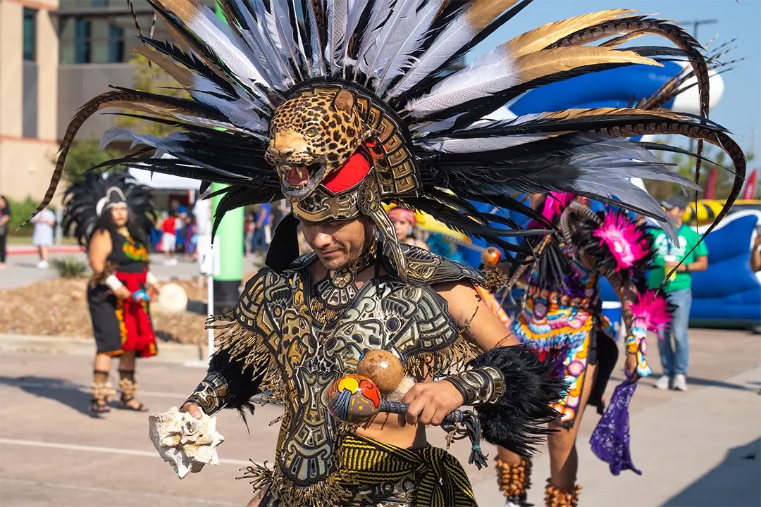 Danza Azteca Xiuhollin Huehuecoyotl perform traditional Aztec dances during Fiesta Comunidad 2024