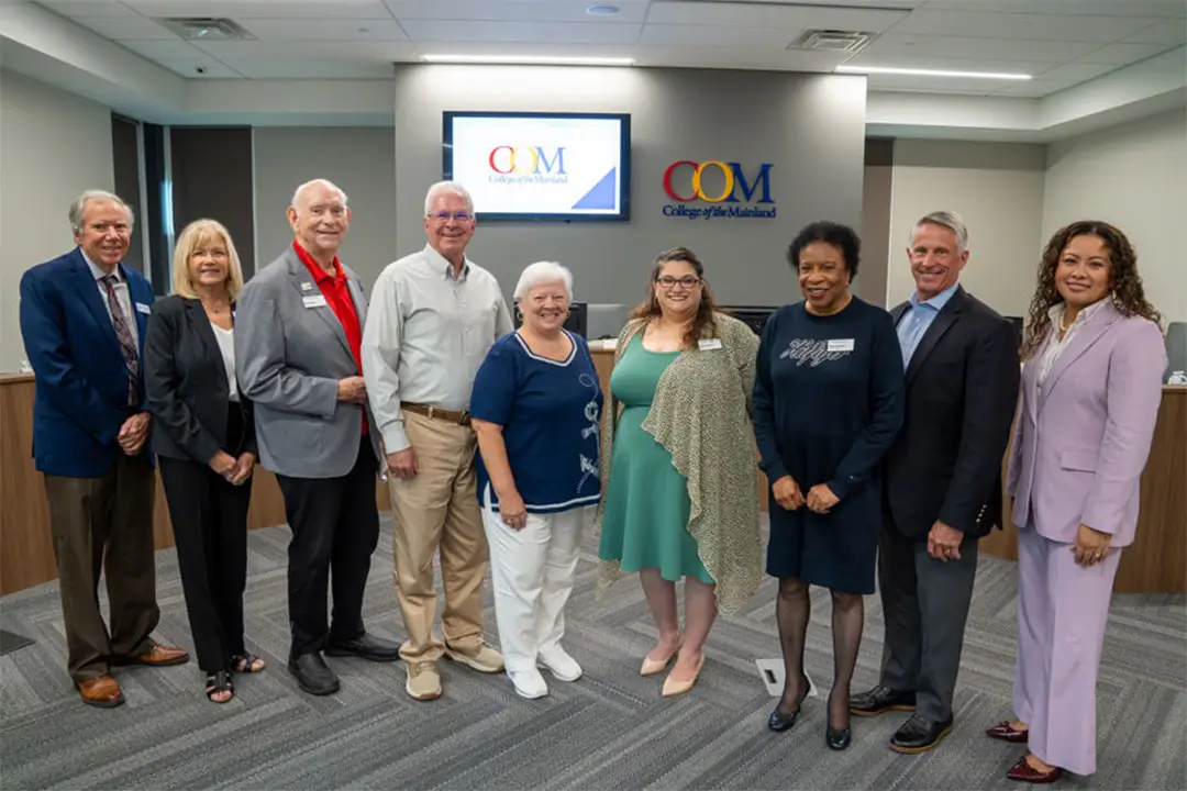 Former COM President Dr. Warren Nichols and his wife, Chris Nichols, stand with the COM Board of Trustees and current president, Dr. Helen Castellanos Brewer.