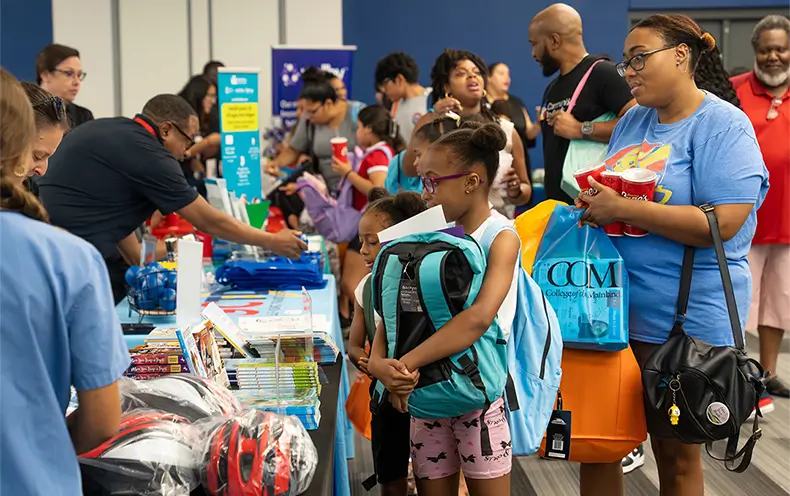 A Family Meets with the Galveston County Medical Society during the Back-to-School Bash at College of the Mainland.