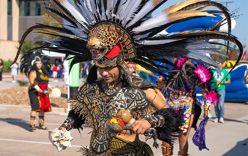 Danza Azteca Xiuhollin Huehuecoyotl perform traditional Aztec dances during Fiesta Comunidad 2024