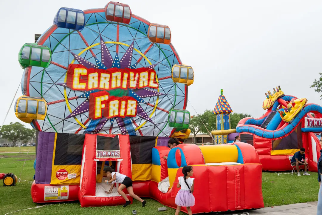Children enjoy bounce houses during Flock the Block 2025 at College of the Mainland.