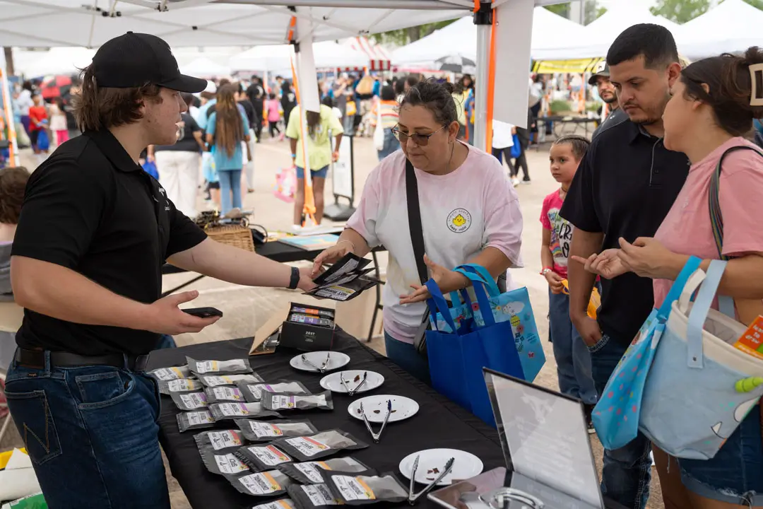 People getting food at an event.