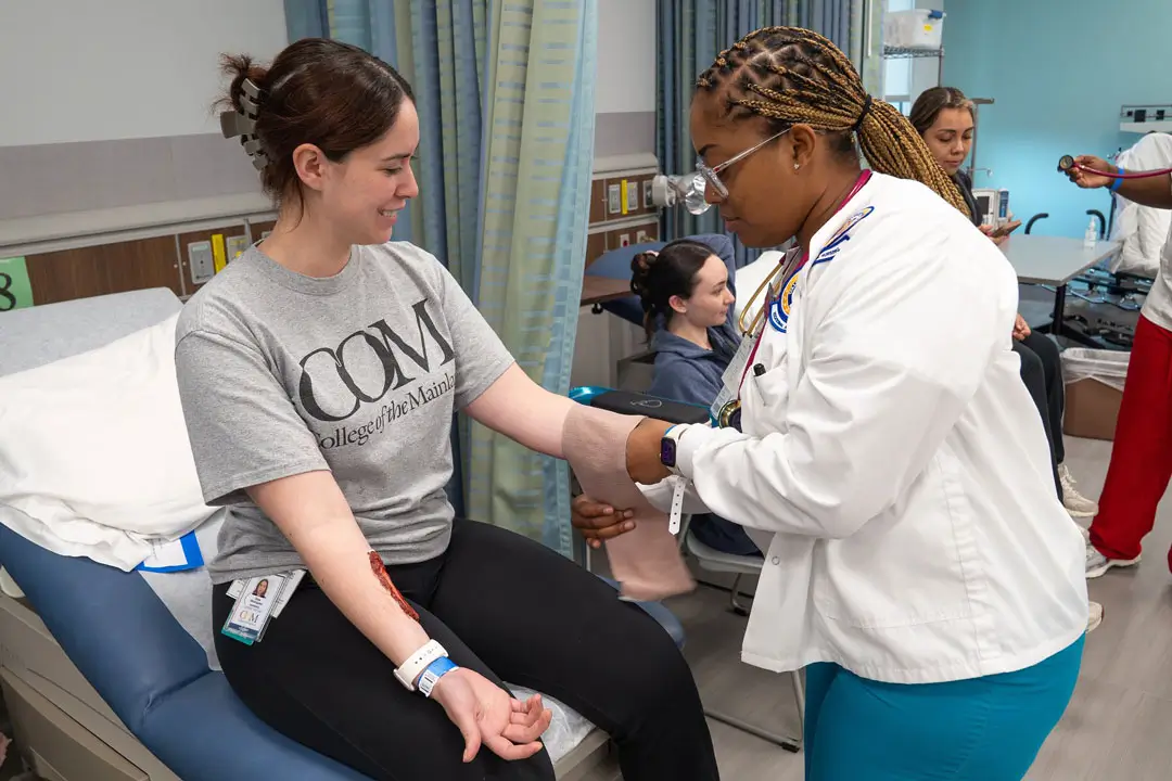 An LVN student bandages up a fellow COM student’s arm during the 2026 Disaster Simulation Day.