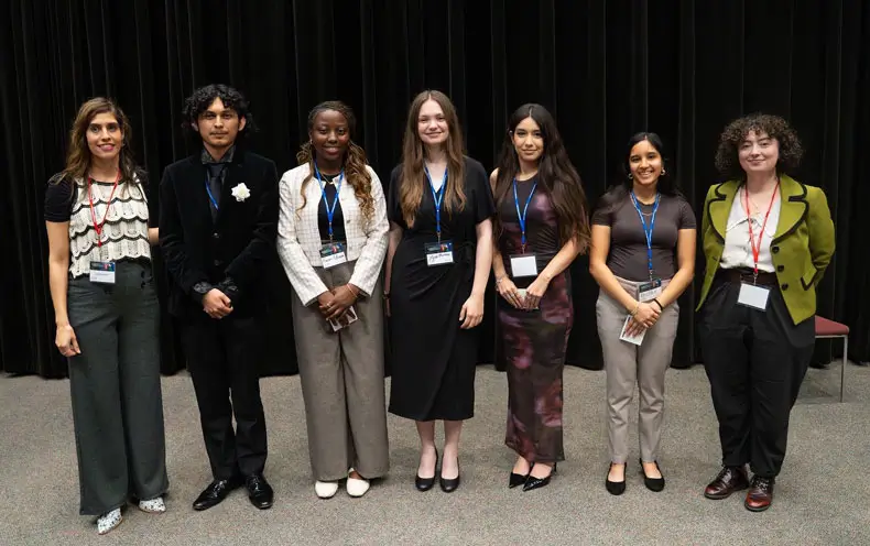 Group of symposium winners on stage