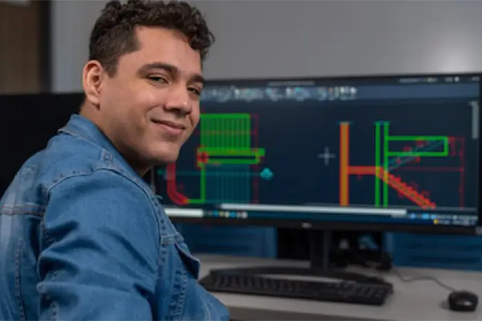 Student at computer in classroom.