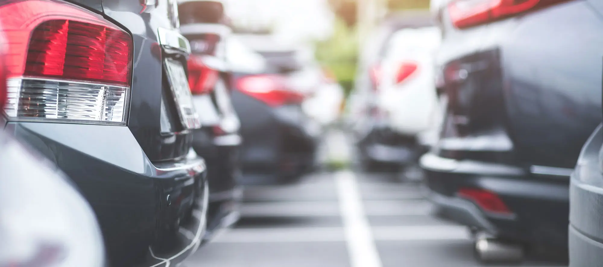 Close up view of cars in a parking lot