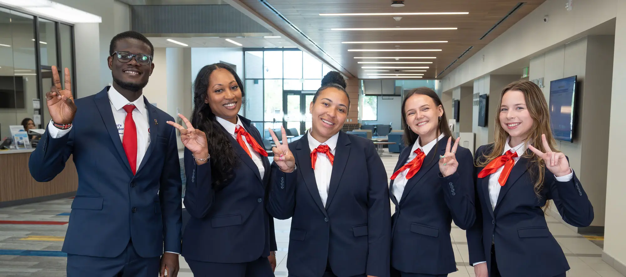 President’s Ambassadors making peace signs towards the camera