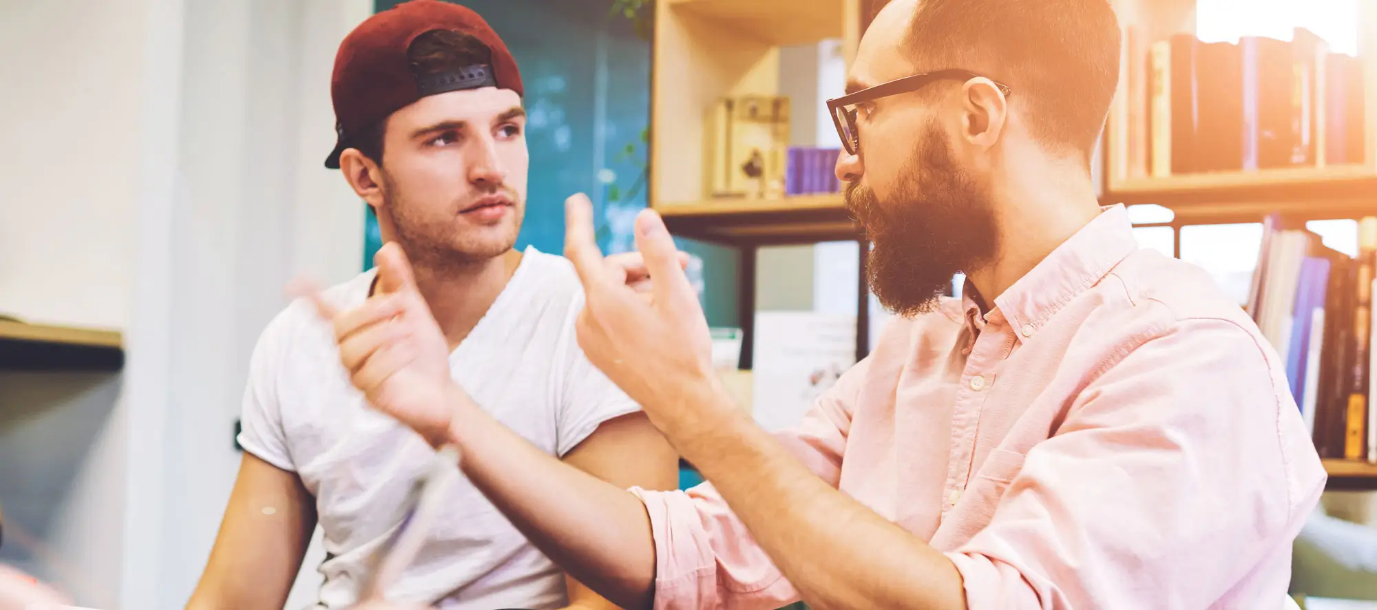 Instructor offering guidance to a student in office