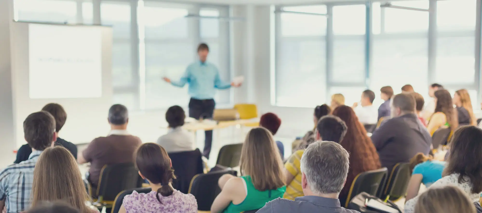 Speakers Giving a Talk at Business Meeting.