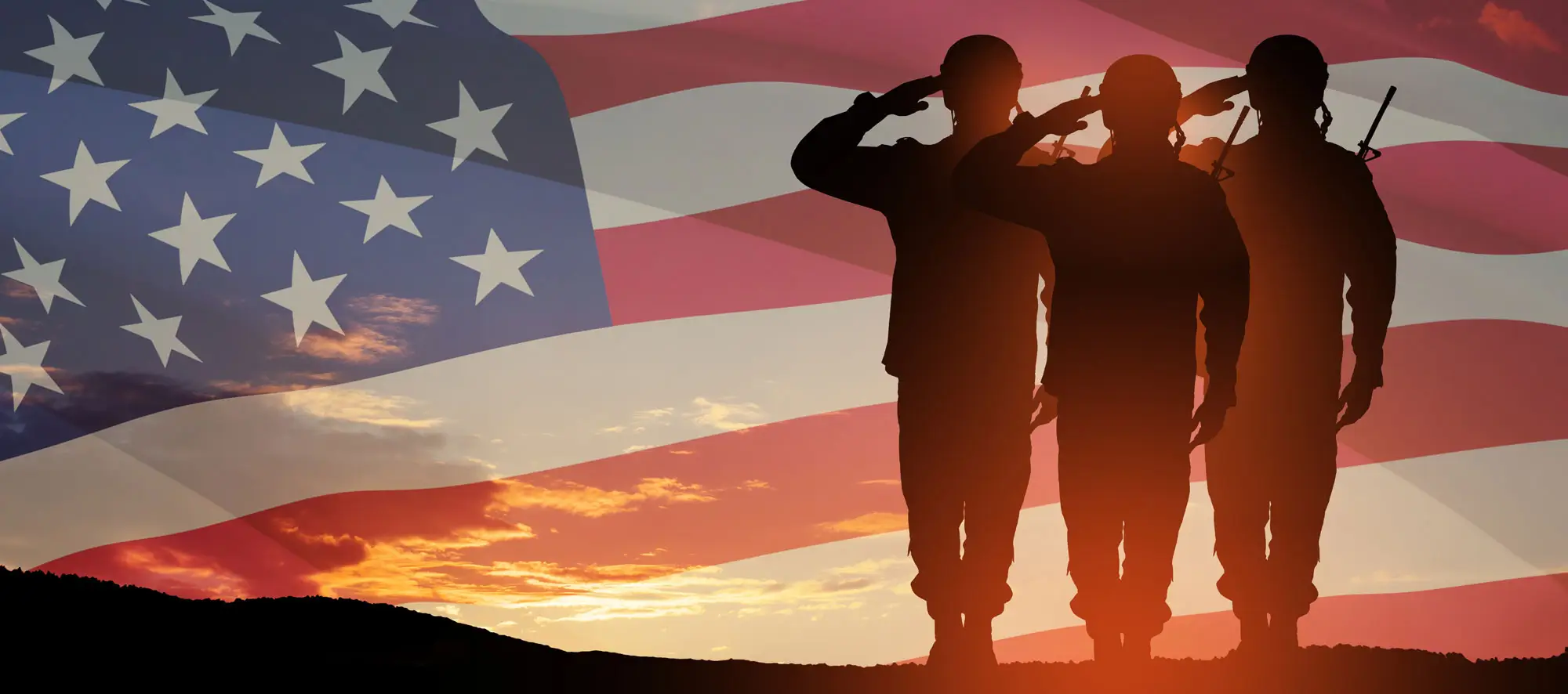 American flag with silhouette of three army soldiers 